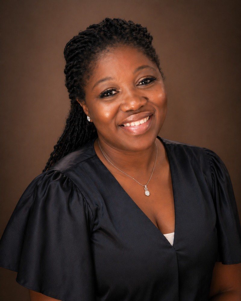 Portrait of Manjiah Ockey, founder of Biofeedback Foundation, smiling.